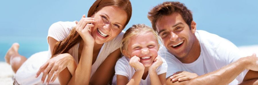 Smiling family with beautiful teeth after visiting our family dentistry in Aiea, HI
